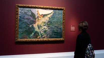A visitor observes 'The White Boat' (1905), by Joaquín Sorolla, in 'Spanish Light: Sorolla in American Collections', at the Meadows Museum.