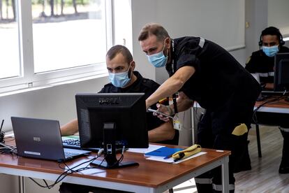 Military members help with coronavirus contact tracking in Spain.