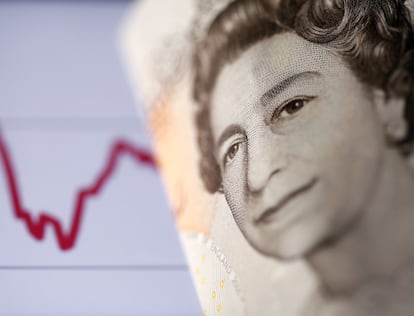 FILE PHOTO: A British pound note is seen in front of a stock graph in this November 7, 2016 picture illustration. REUTERS/Dado Ruvic/Illustration/File Photo