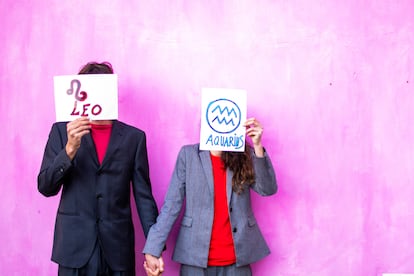 Couple with signs over their faces