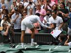 Wimbledon (United Kingdom), 11/07/2021.- Novak Djokovic of Serbia gives his tennis racquet to a young fan after winning the men's final against Matteo Berrettini of Italy at the Wimbledon Championships, Wimbledon, Britain 11 July 2021. (Tenis, Italia, Reino Unido) EFE/EPA/NEIL HALL EDITORIAL USE ONLY