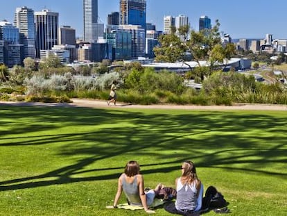 Two young people relax in Kings Park in Perth, Australia.