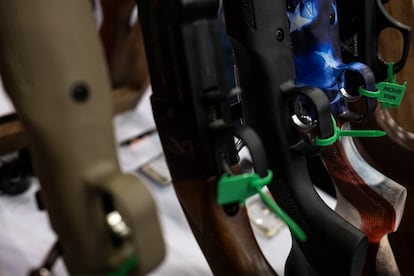 A rifle painted with the U.S. flag is displayed at the National Rifle Association (NRA) annual convention on May 28, 2022, in Houston, Texas.