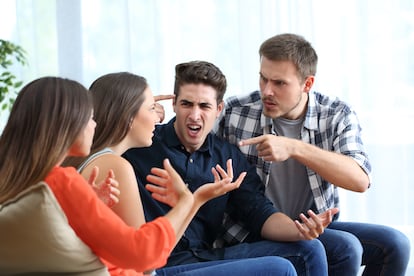 Four angry friends arguing at home