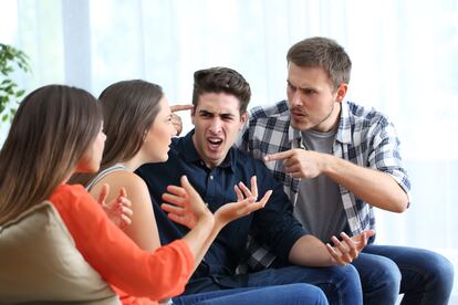 Four angry friends arguing at home