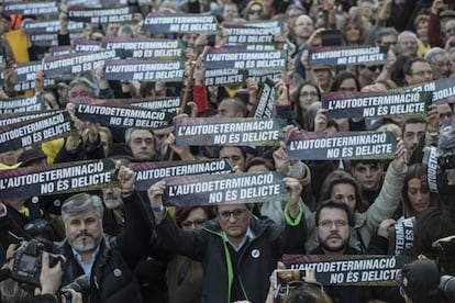 Protesters hold signs with the message: “Self-determination is not a crime.”