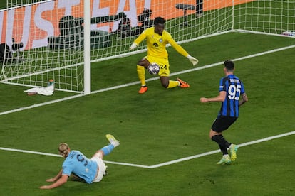 Manchester City's Erling Haaland fires a shot as Inter Milan's goalkeeper Andre Onana saves during the Champions League final soccer match between Manchester City and Inter Milan at the Ataturk Olympic Stadium in Istanbul, Turkey, Saturday, June 10, 2023.