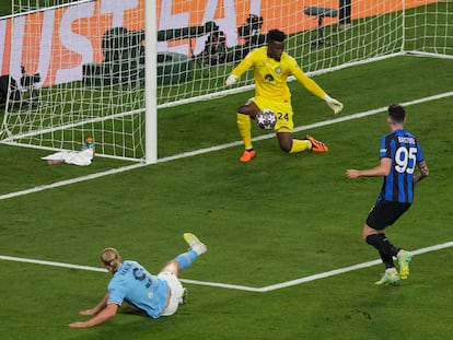 Manchester City's Erling Haaland fires a shot as Inter Milan's goalkeeper Andre Onana saves during the Champions League final soccer match between Manchester City and Inter Milan at the Ataturk Olympic Stadium in Istanbul, Turkey, Saturday, June 10, 2023.