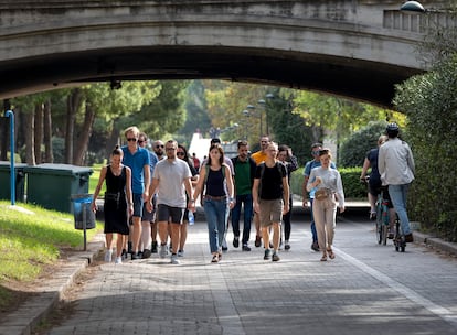 People walking by Cauce del Río in Valencia, Spain