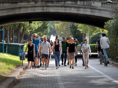 People walking by Cauce del Río in Valencia, Spain