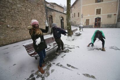 Kids playing with snow in Bunyola, on the island of Mallorca.