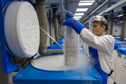 Daniel Alba Olano, a worker at the CNIO biobank, opens one of the containers where the samples from the collection are kept.