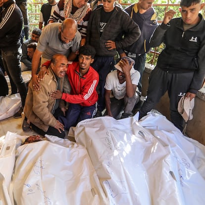 KHAN YUNIS, GAZA - JUNE 3: (EDITORS NOTE: Image depicts death) Relatives and loved ones of Palestinians, who lost their lives after Israeli forces opened fire on a crowd gathered at an aid distribution point in the Al-Alam area of Rafah, mourn for their deceased ones at Nasser Medical Complex during their funeral procedures in Khan Yunis, Gaza on June 3, 2025. (Photo by Abed Rahim Khatib/Anadolu via Getty Images)