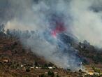 Smoke rises at the Cumbre Viegja volcanic on the island of La Palma in the Canaries, Spain, Sunday, Sept. 19, 2021. A volcano on Spain's island of La Palma eruption Sunday after a weeklong buildup of seismic activity, prompting authorities to start an evacuation plan expected to effect around 1,000 people. (AP Photo/Jonathan Rodriguez)