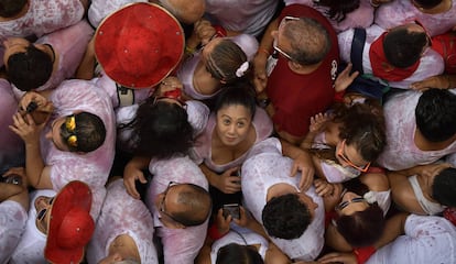 Revellers pack the main square during the launch of the 'Chupinazo' rocket, to celebrate the official opening of the 2018 San Fermin fiestas with daily bull runs, bullfights, music and dancing in Pamplona, Spain, Friday July 6, 2018. (AP Photo/Alvaro Barrientos)