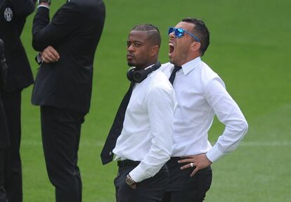 Tévez y Evra.