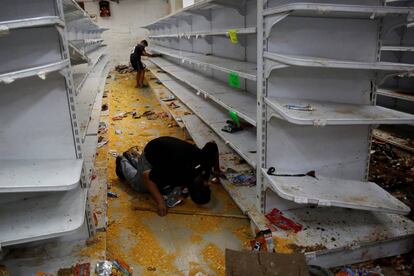 A looted supermarket in Caracas on Friday.