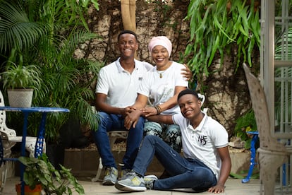 Orphans Kelvin Manuel and Júnior Alberto with Altagracia Valdez Cordero at her home in Santo Domingo.