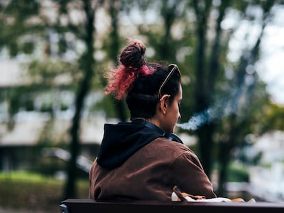 A 23-year-old woman smoking in Madrid.