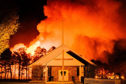 A massive 2,500-acre forest fire burns in Ocean County, N.J., early Wednesday, April 12, 2023, as firefighters battle the blaze