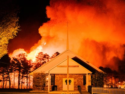 A massive 2,500-acre forest fire burns in Ocean County, N.J., early Wednesday, April 12, 2023, as firefighters battle the blaze