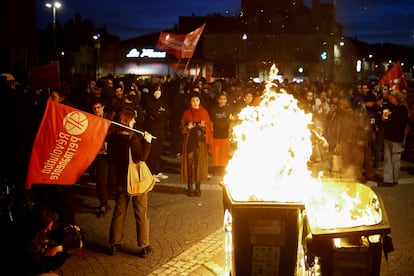 Protesters attend a demonstration on the day the National Assembly debates and votes on two motions of no-confidence against the French government.