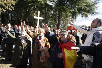 A group of Francoist sympathizers make the fascist salute at the dictator's grave site near Madrid.