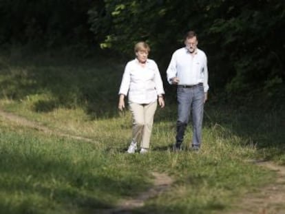 Angela Merkel with Mariano Rajoy in Berlin on Monday.