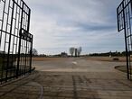(FILES) This file photo taken on April 16, 2020 shows a general view through the open gate of the former Nazi concentration camp of Sachsenhausen in Oranienburg, north of Berlin. - A 100-year-old former concentration camp guard has been charged with complicity in 3,518 murders as Germany races to bring surviving Nazi staff to justice, prosecutors told AFP on February 8, 2021. The man stands accused of "knowingly and willingly" assisting in the murder of prisoners at the Sachsenhausen camp in Oranienburg, north of Berlin, between 1942 and 1945. (Photo by Tobias SCHWARZ / AFP)
