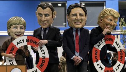 Caricaturas de Merkel, Macron, Trudeau y Trump en una protesta de OXFAM en la COP en Madrid.