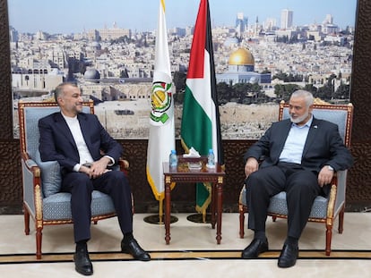 Iranian Foreign Minister Hossein Amir-Abdollahian (L) and Palestinian Islamist group Hamas leader Ismail Haniyeh (R) during a meeting in Doha, Qatar, October 14 2023.