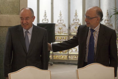 Miguel Ángel Fernández Ordóñez (izquierda) y Cristóbal Montoro en un acto celebrado en 2010.