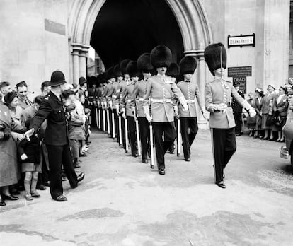 On February 6, 1952, after the death of her father, King George VI, Elizabeth II was proclaimed queen by her various privy and executive councils. Her coronation ceremony, however, did not take place until more than a year later, on June 2, 1953, at Westminster Abbey in London. Elizabeth II swore an oath to uphold the law and govern the Church of England. Pictured are the Grenadier Guards, an infantry regiment of the British Army, marching from Westminster Abbey during a rehearsal for the coronation.