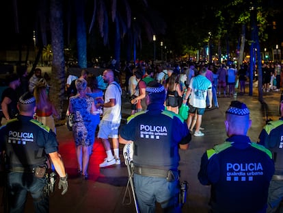 The local police try to clear a beach in Barcelona on Saturday.