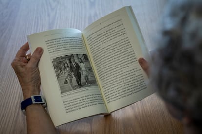 Mailer holds a copy of her memoir.