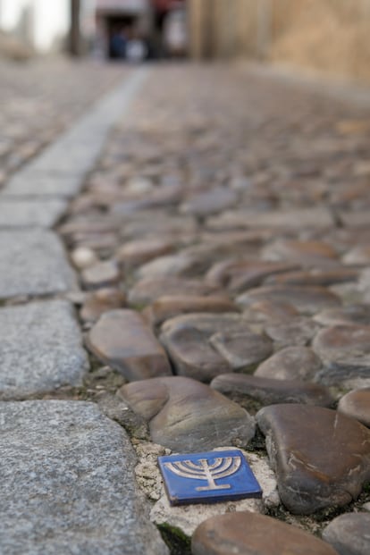 A small menorah embedded in the streets of the Jewish quarter of Toledo. 