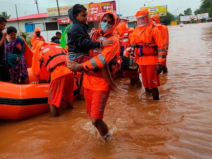 India's National Disaster Response Force personnel rescuing residents in Chiplun area in the western Indian state of Maharashtra, Friday, July 23, 2021.