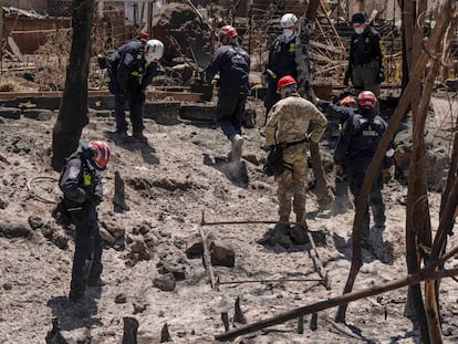 Search and rescue team members work in the area devastated by a wildfire in Lahaina, Hawaii, Thursday, Aug. 17, 2023.