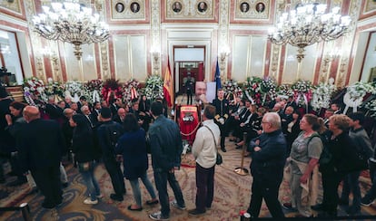 Members of the public file past Rubalcaba’s casket on Saturday.