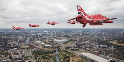 Members of the Red Arrows Royal Air Force Aerobatic Team fly over London, heading for Buckingham Palace, to mark the centenary of the Royal Air Force in central London