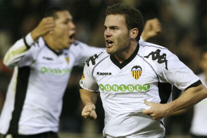 Juan Mata wheels away in delight after scoring Valencia's winning goal against Espanyol.