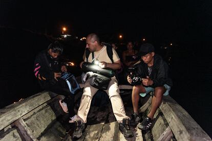 Cristina Benitez (left), Micha Huamán (center) and Bryan Tapayuri prepare their equipment to go record the ayaymama song.