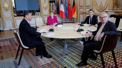 Xi Jinping, Angela Merkel, Emmanuel Macron, y Jean-Claude Juncker reunidos en París.