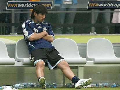 Messi, en el banquillo durante un partido.