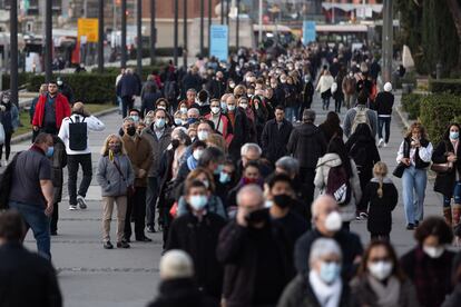 People line up to get vaccinated in Barcelona.