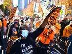 Activists dance in celebration after Democratic presidential nominee Joe Biden overtook President Donald Trump in the Pennsylvania general election vote count across the street from where ballots are being counted, three days after the 2020 U.S. presidential election, in Philadelphia, Pennsylvania, U.S. November 6, 2020. REUTERS/Mark Makela