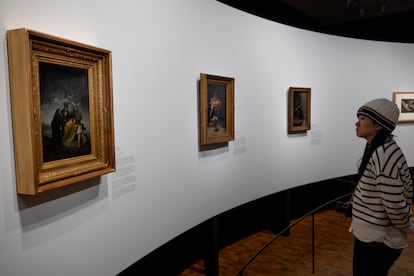 A visitor observes three works by Francisco Goya – 'Witches' Sabbath,  Witches' Flight and The Bewitched Man' – in the exhibition titled 'Goya and Munch: Modern Prophecies', at the Munch Museum in Oslo, on December 6, 2023.