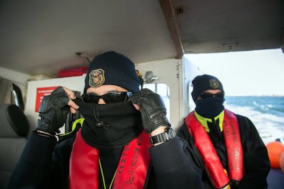 Two Spanish customs surveillance officers get ready to begin a patrol of the area between the Strait of Gibraltar and the Guadalquivir estuary.