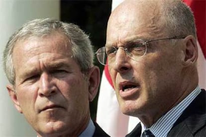 George W. Bush y Henry M. Paulson.