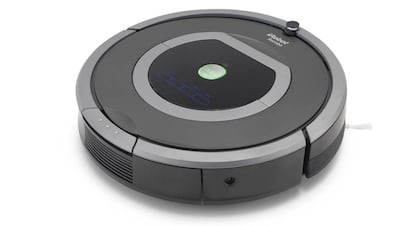 Un aspirador automático, marca Roomba.